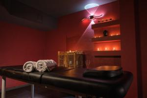 a dark room with a table and a light at Park Hotel Plovdiv in Plovdiv