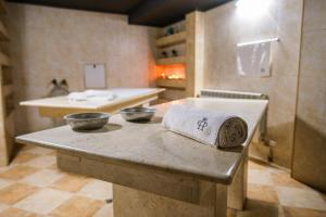 a large kitchen with two bowls on a table at Park Hotel Plovdiv in Plovdiv