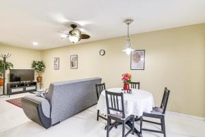 a living room with a table and a couch at Houston Vacation Rental about 1 Mi to NRG Stadium! in Houston