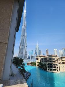 a view of the burj khalifa from the balcony of a building at Downtown Oasis, Burj Khalifa Views, Luxury Amenities in Dubai