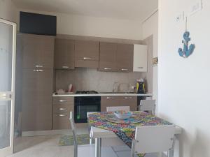 Kuchyň nebo kuchyňský kout v ubytování DiVino Appartamenti Vista Mare