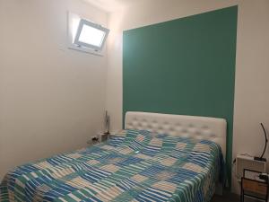 Postel nebo postele na pokoji v ubytování DiVino Appartamenti Vista Mare