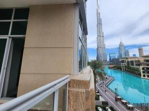 a balcony of a building with a view of the city at Downtown Oasis, Burj Khalifa Views, Luxury Amenities in Dubai