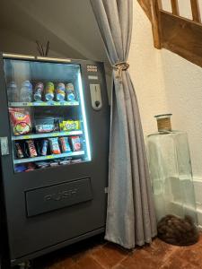 a refrigerator filled with drinks and snacks in a room at Studio #1 hyper centre Gordaine in Bourges