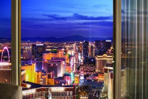 a view of a city at night from a window at Trump International Hotel in Las Vegas