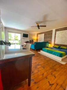 a living room with a bed and a couch at CASA DE RELAX CON PISCINA in Paraná +26 photos