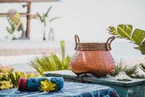 a basket sitting on top of a table at Empire Beach Resort ADULTS ONLY in Dhërmi
