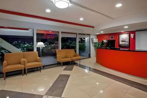 a lobby with two chairs and a waiting room at Econo Lodge in Red Bluff