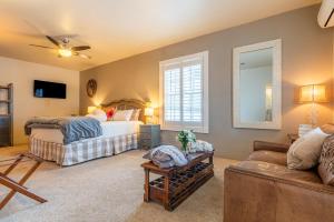 a bedroom with two beds and a couch at Antlers on the Creek Bed & Breakfast in Durango