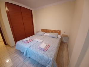 Postel nebo postele na pokoji v ubytování ÁTICOS BELLA LUCÍA + 37 fotografií