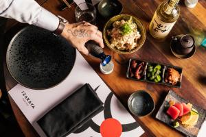 a wooden table with food on top of it at Hotel Indigo Brisbane City Centre, an IHG Hotel in Brisbane