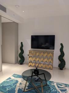 a living room with a tv and a coffee table at Soho West End in London