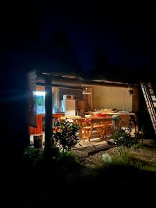 a kitchen with a table and a dining room at Verde viento in La Paloma
