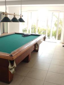 a pool table in the middle of a room at Seaside holiday house Cove Tri luke, Korcula - 22092 in Vela Luka