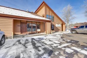 a building with a car parked in front of it at Warm McCall Condo Half-Mile to Payette Lake! in McCall