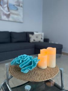 a table with three candles on top of a table at Beach-Style Pool Villa Paradise in Río Hato