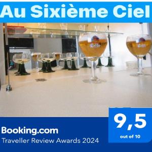 a group of wine glasses sitting on a counter at - - - - - Au Sixième Ciel - - - - - in Brussels