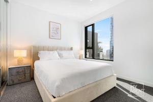 Ένα ή περισσότερα κρεβάτια σε δωμάτιο στο 2 Bedroom Apartment in Southbanks Stature Building +14 φωτογραφίες