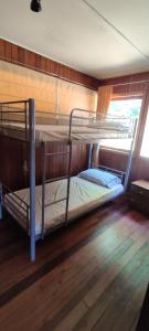 a bunk bed room with two bunk beds on a boat at Casa Carlota in Futrono