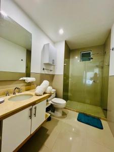 a bathroom with a toilet and a glass shower at MORROS EPIC luxury in Cartagena de Indias