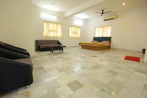 a large living room with two couches and a couch at ROHAN HOUSE in Nashik