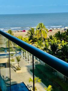 a view of the beach from the balcony of a resort at morros epic luxury in Cartagena de Indias