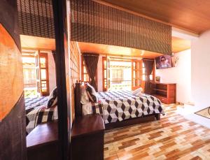 1 dormitorio con 2 camas en una habitación en Casa Custodia en Ráquira