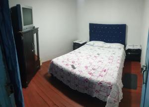 Postel nebo postele na pokoji v ubytování Hostal Perla Del Norte