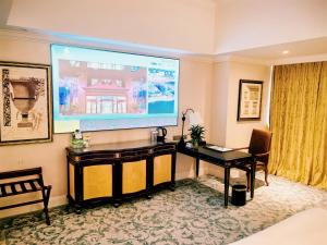 TV a/nebo společenská místnost v ubytování Qingdao Jianxin International Hotel