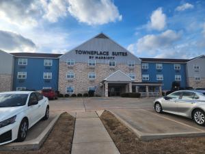 a large building with cars parked in a parking lot at TownePlace Suites by Marriott Killeen in Killeen