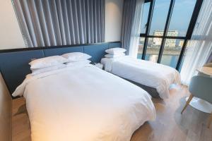 Postel nebo postele na pokoji v ubytování Citadines Connect Hari Busan