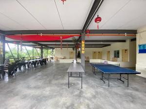 a large room with a ping pong table in it at Kesang Farm Jasin Melaka by I Housing in Jasin