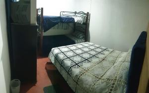 Postel nebo postele na pokoji v ubytování Hostal Perla Del Norte