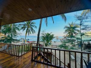 a balcony with a view of the beach at Bai Thom Retreat in Phú Quốc