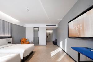 Postel nebo postele na pokoji v ubytování Atour Light Hotel Zhoushan Dinghai South Renmin Road + 31 fotografií