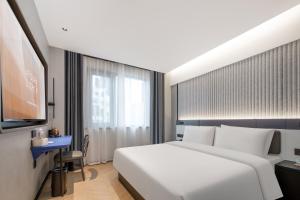Postel nebo postele na pokoji v ubytování Atour Light Hotel Zhoushan Dinghai South Renmin Road