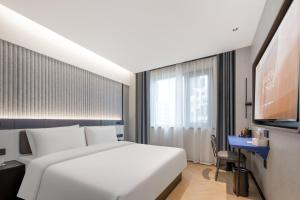 Postel nebo postele na pokoji v ubytování Atour Light Hotel Zhoushan Dinghai South Renmin Road