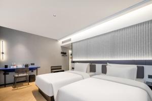 Postel nebo postele na pokoji v ubytování Atour Light Hotel Zhoushan Dinghai South Renmin Road