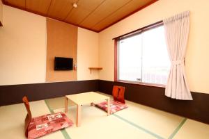 Una televisión o centro de entretenimiento en 民宿ふくだ