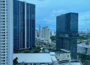 a view of a city skyline with tall buildings at 2 BR I ANDERSON I 22floor I above pakuwon mall I the biggest shopping center in Surabaya