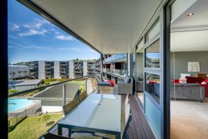 a view from the balcony of a house at The Bay Bach - Napier Holiday Apartment in Napier