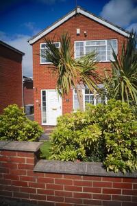 a brick house with bushes in front of it at 3 Bed House with Exceptional view in Batley