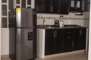 Η κουζίνα ή μικρή κουζίνα στο Apartamento Anawasi, Terraza Privada, Camas Queen y Parqueadero +17 φωτογραφίες