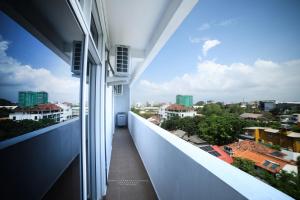 a balcony with a view of a city at BNB RESIDENCIES MOUNT LAVINIA 2 in Mount Lavinia