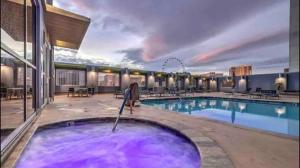 a pool in a hotel with a purple pool at Princess II Suite Platinum * Balcony Strip Views in Las Vegas