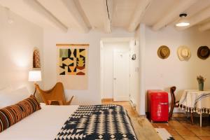 a bedroom with a bed and a table in a room at Pueblo Bonito Santa Fe in Santa Fe