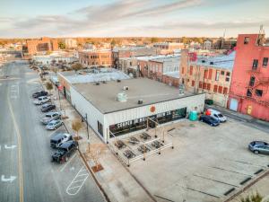 an overhead view of a city with a parking lot at Deluxe Studio in Historic Downtown Building! in Bartlesville