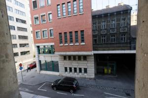a black car parked in front of a building at Pest-port apartment 4 rooms for 16 person in Budapest