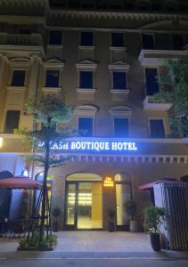 a hotel with a sign that reads asian boutique hotel at Milash Boutique Hotel in Ha Long