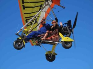 a group of people riding on top of a biplane at Sovereign Paradise - Unit 22 in KwaDukuza